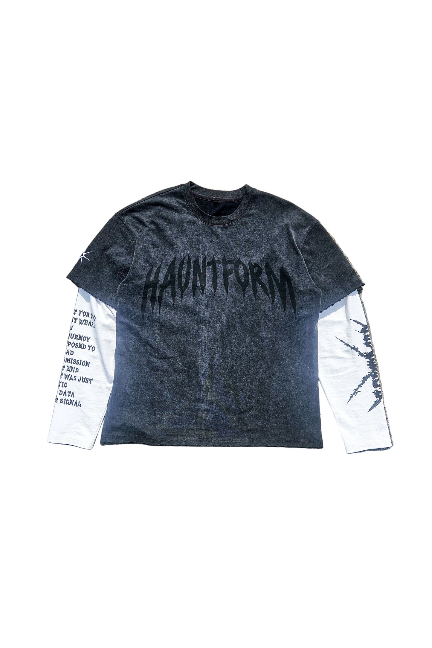 Long-sleeve shirt with 'HAUNTFORM' branding on a concrete surface