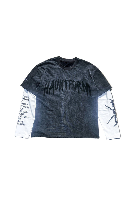 Long-sleeve shirt with 'HAUNTFORM' branding on a concrete surface